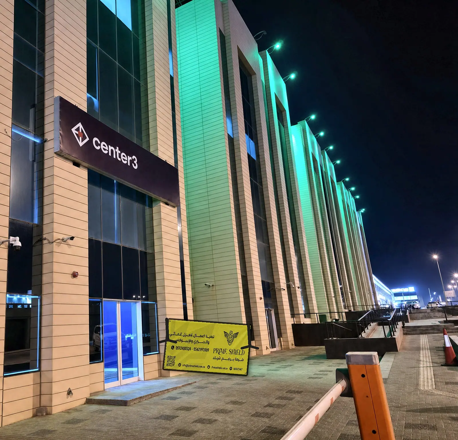 Prime Shield board at the entrance of a center3 building at night