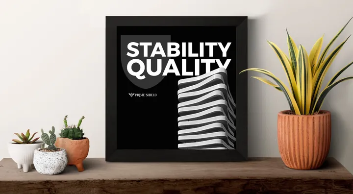 لوحة مؤطرة بعنوان Stability Quality وشعار برايم شيلد على رف